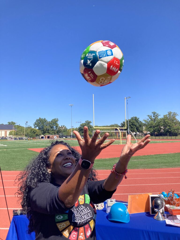 Ms. Nichelle Calhoun, co-leader of SDG alignment in Coolidge’s Redesign, celebrates at the Global Goals Week event in September 2023 (photo courtesy of Abby Quirk)